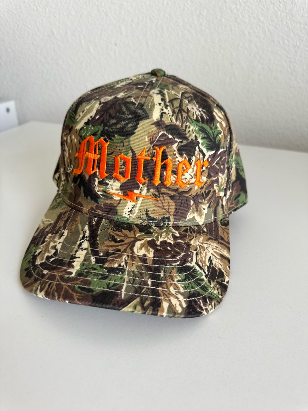 Camo Baseball Cap with Orange "Mother" Embroidery